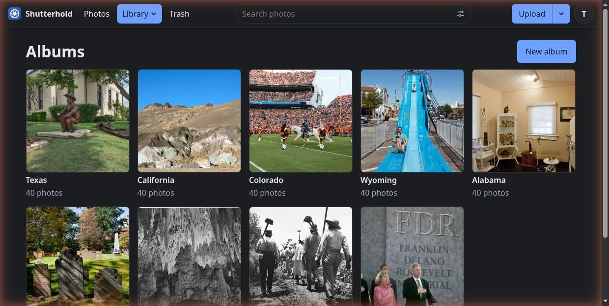 The Albums page: a grid of album covers with their names and photo counts